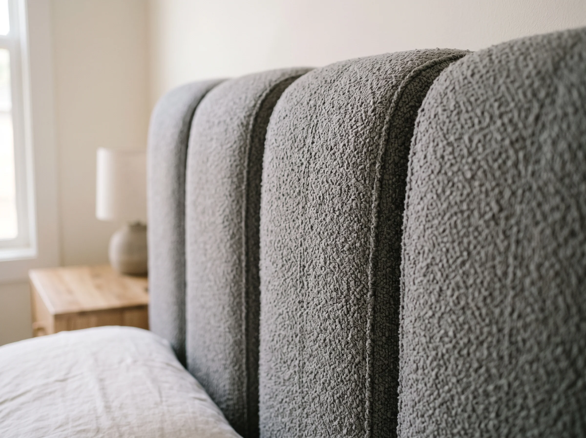 Channel-tufted upholstered headboard fabric detail for UAE bedrooms